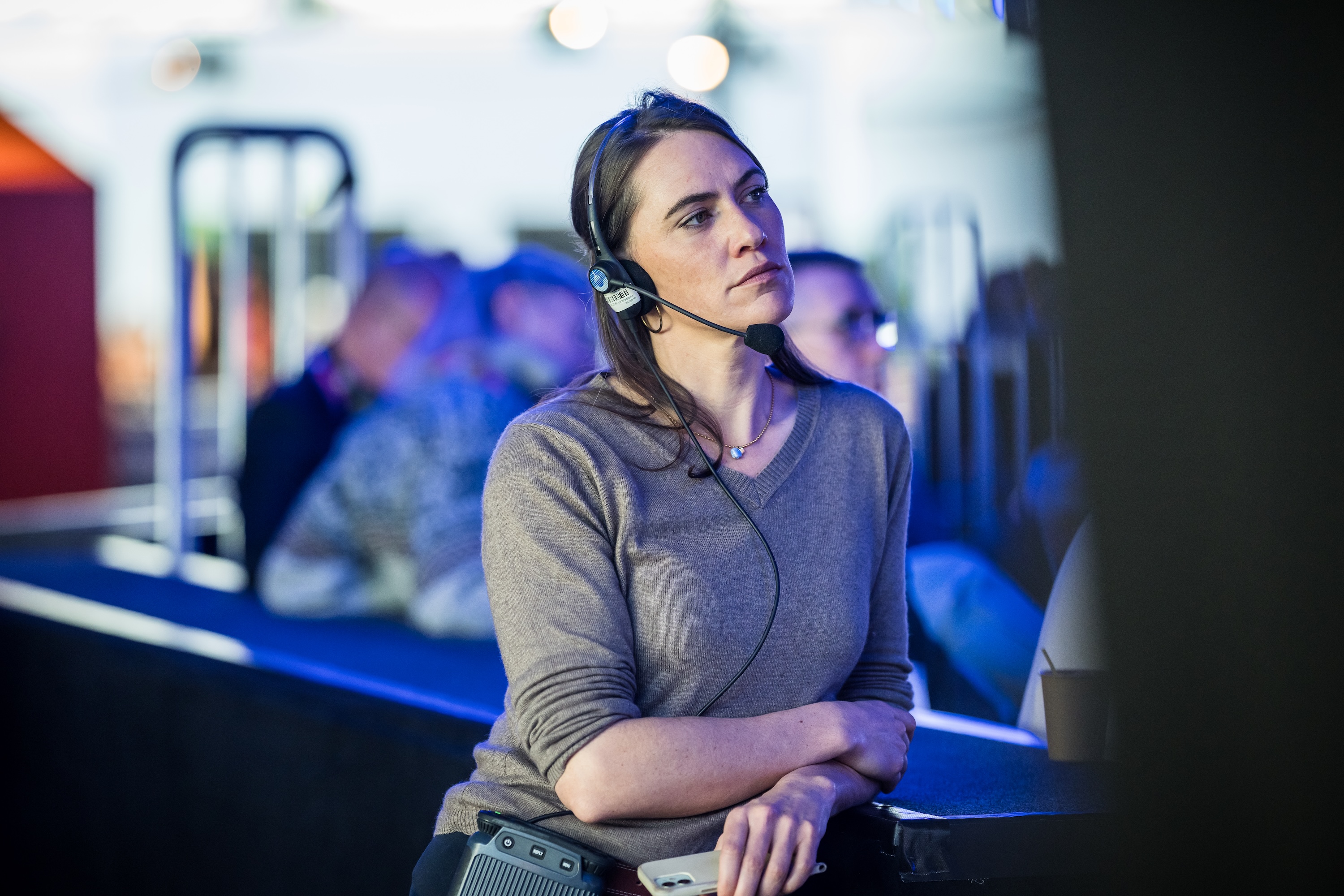 Event technician with headset managing a live event production from the control area