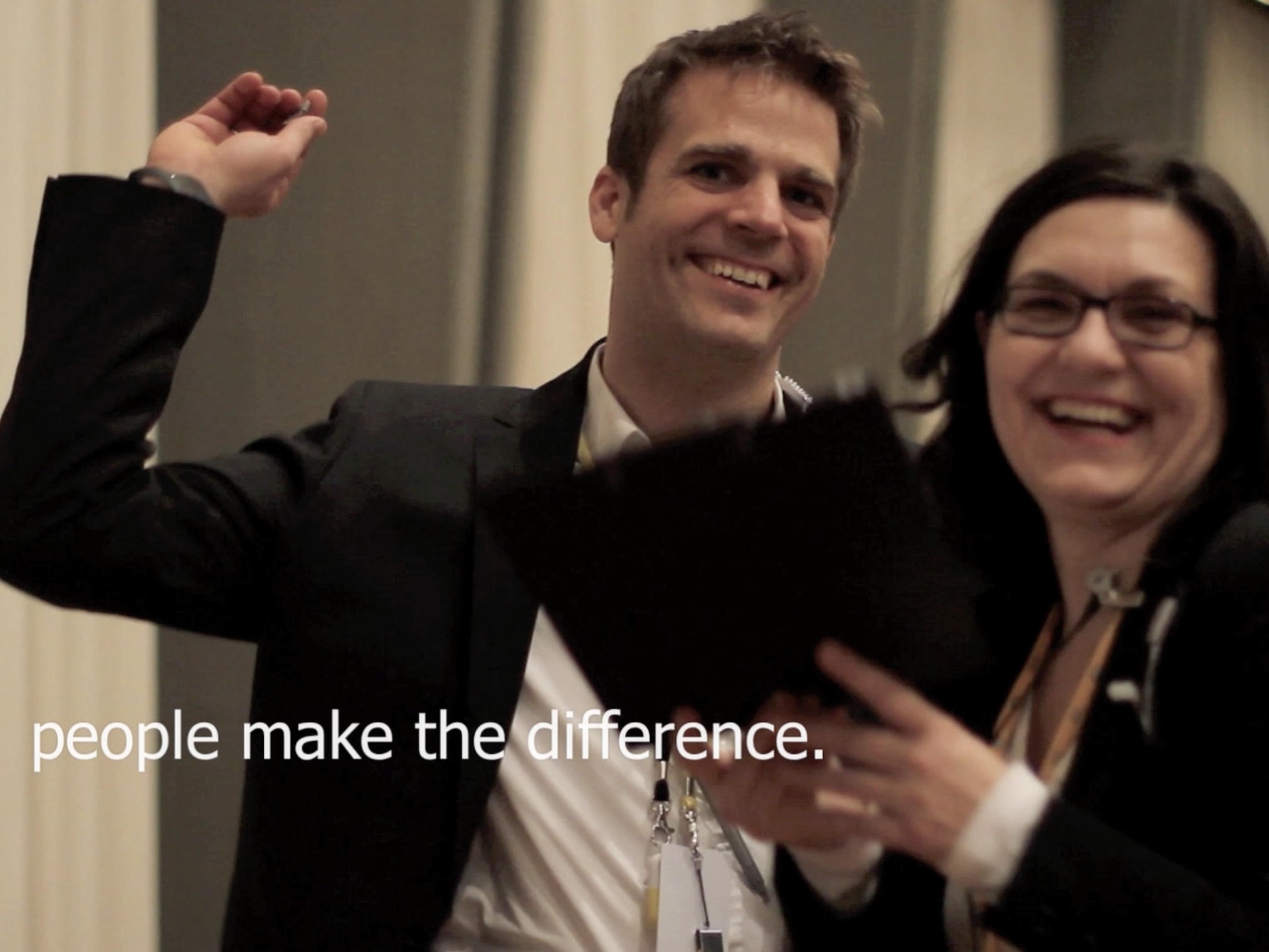Christine and another team member with the slogan "people make the difference"